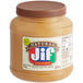A Jif peanut butter jar on a table.