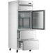 An Avantco stainless steel reach-in refrigerator with two drawers open.