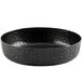 A black aluminum serving platter with a crackle pattern on the rim.