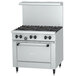 A white Garland SunFire commercial gas range with black knobs.