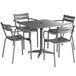 A Lancaster Table & Seating matte gray metal outdoor dining table with 4 chairs with a white background.