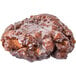 A close up of a Rich's apple fritter yeast donut with icing on top.