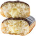 A Rich's unfilled long john yeast donut with chocolate and butter on top.