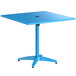 A blue square table with a black umbrella hole on a metal base.