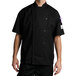 A man wearing a black Chef Revival chef coat.