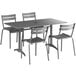 A Lancaster Table & Seating matte gray aluminum outdoor dining table with 4 chairs.
