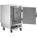 A large metal ServIt holding and proofing cabinet with a solid door open.