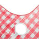 A red and white checkered vinyl table cover with an umbrella hole.