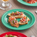A red Acopa Foundations melamine plate with salsa and tomato on toasted bread.