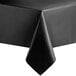 A black vinyl table cover with a folded edge on a table.