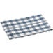 A folded navy blue and white checkered vinyl table cover.