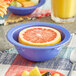 A bowl of grapefruit in an Acopa Foundations purple melamine bowl.