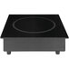 A black square induction range with a white circular design and line.