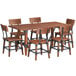 A Lancaster Table & Seating solid wood dining table with 6 chairs.