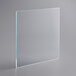 A clear glass square shelf with white lines on a gray surface.