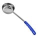 A stainless steel portion spoon with a blue handle.