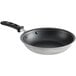 A Vollrath black stainless steel frying pan with a black handle.