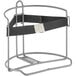 A grey metal wire rack with a black strap on it.