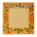 A square plate with a painted floral design including flowers and a yellow border.