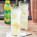 Two glasses of ReaLemon lemonade on a table.