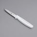 A Choice paring knife with a white plastic handle.