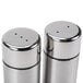 Two stainless steel American Metalcraft salt and pepper shakers.