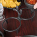 A black polyethylene holder with two molcajete bowls of salsa and tortilla chips.