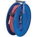 A blue Coxreels hose reel with a medium pressure hose on it.