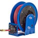 A blue and black Coxreels hose reel with a red and blue hose.