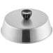 An American Metalcraft aluminum basting cover with a black handle on top of a round surface.