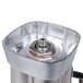 A Waring stainless steel blender container with a lid.