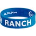 A blue silicone wristband with white text that says "Ranch"