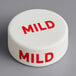 A white circular silicone lid with red text that says "Mild"