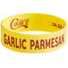 A yellow silicone wristband with red "Garlic Parmesan" text.