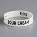 A white silicone band with black text that says "Sour Cream"