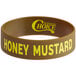 A brown rubber wristband with yellow text that says "Honey Mustard"