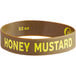 A brown rubber wristband with yellow text that reads "Honey Mustard"