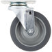 A Main Street Equipment swivel plate caster with a metal wheel and black base.