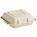 A Tellus Products natural bagasse clamshell container with 3 compartments and a lid.