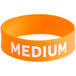 An orange silicone wristband with the word "Medium" in white text.
