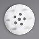 A white circular Carpigiani nozzle with holes.