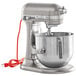 A silver KitchenAid Bowl Lift countertop mixer with a bowl and standard accessories.