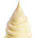 A white swirly ice cream cone with a yellow tip.