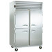 A Traulsen 2 section half door reach in freezer with left and right hinged doors.