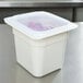 A white Cambro container with a translucent plastic lid on it.