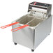 A Cecilware stainless steel commercial countertop electric deep fryer with red handles.