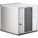 A white rectangular Scotsman Prodigy Plus air cooled flake ice machine with a red button.
