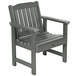 A gray outdoor arm chair with faux wood armrests.