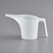 A Fox Run translucent plastic measuring cup with a handle on a gray surface.