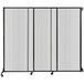 A clear poly wall-mounted sliding room divider with a white frame.